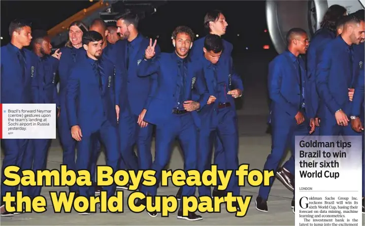  ?? AFP ?? Brazil’s forward Neymar (centre) gestures upon the team’s landing at Sochi airport in Russia yesterday.