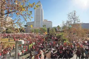  ?? DAMIAN DOVARGANES/AP ?? Thousands of teachers rallied at Los Angeles City Hall last month. Teachers in the nation’s second-largest school district will go on strike Monday if there’s no settlement of its contract dispute.