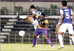  ?? SREY MENG SRUN ?? Nagaworld’s Autheire Kipson (centre) fends off an AEU defender at Olympic Stadium on Saturday.