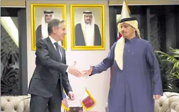  ?? Mark Schiefelbe­in Pool Photo ?? SECRETARY of State Antony J. Blinken and Qatar’s Prime Minister Sheikh Mohammed bin Abdulrahma­n al Thani meet in Doha. Qatar, which has long mediated with Hamas, has been working on a cease-fire deal.