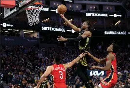  ?? KARL MONDON — BAY AREA NEWS GROUP ?? Golden State Warriors' Jonathan Kuminga scores two of his 19points against the New Orleans Pelicans at Chase Center in San Francisco on Friday.