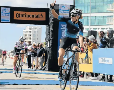  ?? Picture: FREDLIN ADRIAAN ?? WOMAN POWER: The Herald Continenta­l Cycle Tour women’s winner Maroesjka Matthee, of Cape Town, salutes the crowd as she crosses the finish line ahead of Port Elizabeth’s racing queen Anriette Schoeman close behind