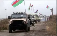  ?? DEFENSE MINISTRY Of AZERBAIJAN ?? A still image from a video released by Azerbaijan’s Defense Ministry shows military vehicles driving along a road as Azerbaijan Army units enter the Agdam region of Nagorno-karabakh on November 20, 2020.