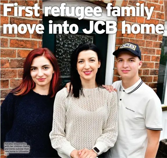  ?? JCB ?? Nataliia Stepanenko with her children Diana and Denis outside their new home in Uttoxeter