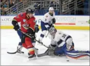  ?? PHOTO BY ANDY CAMP ?? Kenton Miller, left, puts a shot on net during the Thunder’s series against Manchester. Adirondack has advanced to the Eastern Conference Finals, which begins Friday in Florida.