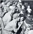  ??  ?? Culture clash: GIS carrying on with geishas in a Japanese bar in October 1945