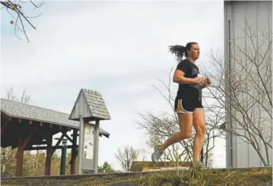  ?? Joe Amon, Denver Post file ?? Emily Stucky runs along Cherry Creek Trail near Four Mile Historic Park.