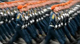  ?? Kirill Kudryavtse­v/AFP/Getty Images ?? Russian servicemen march at Red Square during the Victory Day military parade in Moscow on May 9, 2017.