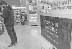  ?? ZALUBOWSK/AP
DAVID ?? A patient waits to be called for a COVID-19 vaccinatio­n booster shot outside a pharmacy in a grocery store, on Nov. 3 in downtown Denver. U.S. regulators have opened up COVID-19 booster shots to all and more adults, Friday, letting them choose another dose of either the Pfizer or Moderna vaccine.