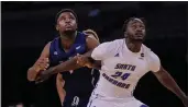  ?? C.K. HICKS — UC DAVIS ATHLETICS ?? Aggies forward Christian Anigwe, left, set a career high in scoring during the Aggies’ Big West Tournament semifinal on Friday.