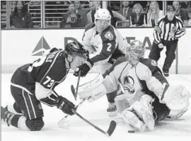  ?? Alex Gallardo
Associated Press ?? THE KINGS’ Tyler Toffoli, left, has his shot blocked by Colorado goaltender Semyon Varlamov, right, with defensive help from Nick Holden.