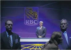  ?? COLE BURSTON/BLOOMBERG FILES ?? Royal Bank CEO Dave McKay, centre, says the banks’ best defence for now against the threat of platform players is the trust clients have in them to provide security and protection.
