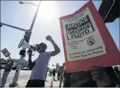  ?? RINGO H.W. CHIU — THE ASSOCIATED PRESS FILE ?? Under a new law that went into effect July 1, the California Department of Justice will now be responsibl­e for investigat­ing the fatal police shootings of unarmed civilians, taking over from local agencies.