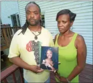  ?? PETE BANNAN — DIGITAL FIRST MEDIA ?? Rodney and Michelle Roberson hold a photo of their daughter, Bianca Nikol Roberson who was shoot and killed as she drove home on the Route 100Bypass in a road rage incident on June 28.