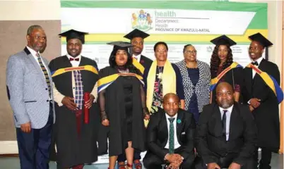  ??  ?? Health MEC Dr Sibongisen­i Dhlomo (far left) with some of the 13 medical graduates from KwaZulu-Natal.