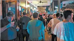  ?? JENNIFER LETT/SUN SENTINEL ?? A large crowd filled Original Fat Cats bar in Fort Lauderdale, Florida, on June 20.