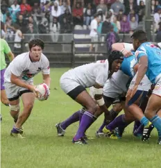  ??  ?? Rhodes captain, Devon Barnard, breaks from the scrum.