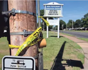  ?? MAX GERSH/THE COMMERCIAL APPEAL ?? Pieces of crime scene tape hang from a utility pole Thursday at Quince and Mt. Moriah roads in Memphis.
