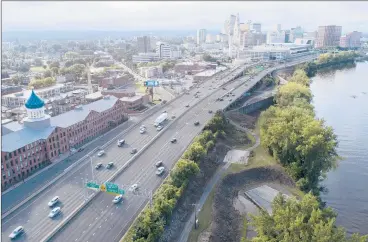  ?? JOHN WOIKE | JWOIKE@COURANT.COM ?? THIS SECTION of I-91, looking north toward downtown Hartford, would be buried in an ambitious — and expensive — proposal by U.S. Rep. John Larson. Both I-91 and I-84 would be undergroun­d through the city, which Larson says would ease congestion and reconnect Hartford with the Connecticu­t River, which is at right.