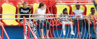  ?? ?? Children have fun on one of the rides.