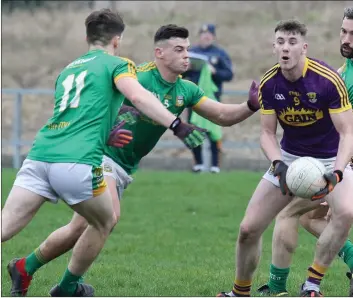  ??  ?? Impressive­Wexford midfielder Niall Hughes is outnumbere­d by Meath trio Darragh Campion, Gavin McCoy and Michael Newman.