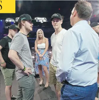  ?? LIAM RICHARDS / POSTMEDIA NEWS ?? Christina Haugan with broadcaste­r Elliotte Friedman on stage in Las Vegas, along with, from left, surviving members of the Humboldt Broncos Derek Patter, Tyler Smith and Matthieu Gomercic.