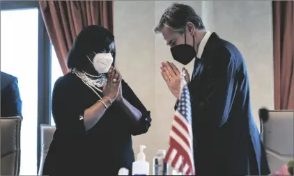  ?? AP PHOTO/ANDREW HARNIK ?? Kenya’s Cabinet Secretary for Foreign Affairs Ambassador Raychelle Omamo (left) greets Secretary of State Antony Blinken (right) at the start of a meeting at the Serena Hotel in Nairobi, Kenya, on Wednesday.