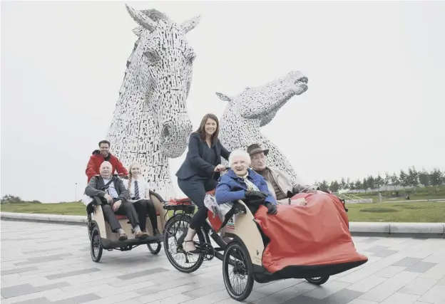  ??  ?? 0 Public health minister Aileen Campbell takes Mary Duncan, 90, and Jim Taylor, 96, for a spin, while Alistair Smith pilots Norman Ridley, 81, and Amelia Franchi, 14