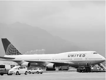  ??  ?? A United Airlines plane on the tarmac at Hong Kong Internatio­nal Airport in Hong Kong, China, on Nov 15, 2015. — WP-Bloomberg photo