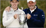 ?? ?? WIN: Fitzpatric­k (left) with caddie Billy Foster