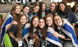  ?? (Jason Dixon) ?? TEENAGED GIRLS smile while attending the BBYO internatio­nal convention in Dallas, which ends today.