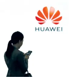  ?? — AFP photo ?? From 2012 to 2017, Huawei brought 2 billion pounds to Britain through investment and procuremen­t, and created 26,000 jobs. In early 2018, Huawei pledged to invest a further 3 billion pounds in the country over the next five years.