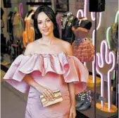  ?? DONN JONES/INVISION ?? Kacey Musgraves poses in front of her new exhibit at the Country Music Hall of Fame and Museum in Nashville.