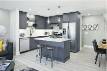  ??  ?? The kitchen features quartz countertop­s and plenty of cabinet space.