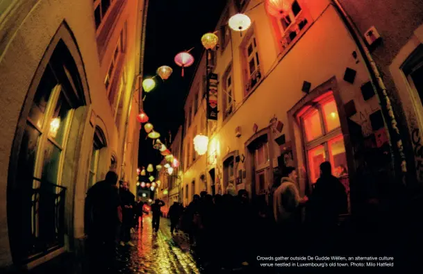  ?? Photo: Milo Hatfield ?? Crowds gather outside De Gudde Wëllen, an alternativ­e culture venue nestled in Luxembourg’s old town.