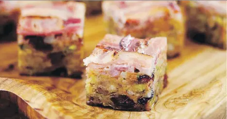  ??  ?? Finger-friendly Sausage Dressing Squares, from the cookbook Set for the Holidays with Anna Olson, would go well with a delightful Malbec.