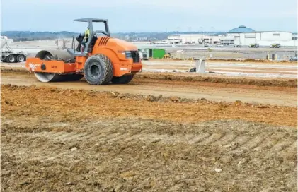  ?? STAFF FILE PHOTO BY TIM BARBER ?? Excavation work continues in late January on a new 520-space economy parking lot with shuttle service to the main terminal at the Chattanoog­a Metropolit­an Airport. The dome for the terminal is seen, top right, in this view looking north near Airport Road.