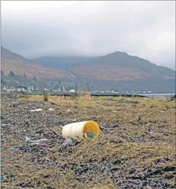  ??  ?? Plastic debris at the head of Loch Long near Arrochar.