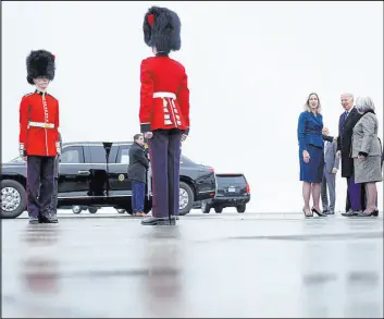  ?? Evan Vucci The Associated Press ?? President Joe Biden speaks with Kirsten Hillman, Canada’s ambassador to the United States, left in blue, and Canada’s Gov. Gen. Mary Simon, right, as Biden arrives Thursday at Ottawa Internatio­nal Airport in Ottawa, Canada. Biden saw his approval rating fall since a month ago, nearing the lowest point of his presidency.