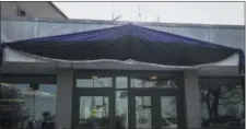  ?? ANNIE COSTABILE — CHICAGO SUN-TIMES VIA AP ?? This photo from video shows purple and black bunting outside Chicago Police District 2 Wentworth headquarte­rs at 5101 S. Wentworth on Tuesday in memory of slain Chicago Police Officer Samuel Jimenez.