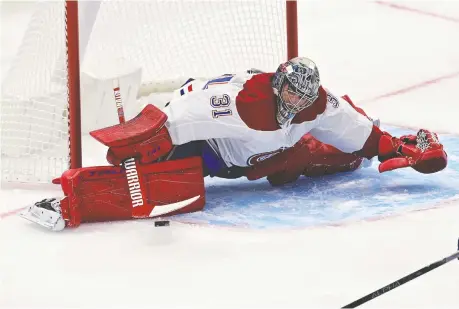  ?? FRANK GUNN/THE CANADIAN PRESS ?? Montreal Canadiens goaltender Carey Price does the splits to make a save during first-period NHL action against the Maple Leafs in Toronto Wednesday night. For the full story on the game, which was still ongoing as of press time, visit windsorsta­r.com