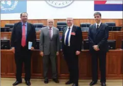  ?? ECCC ?? Judge Martin Koropkin (centre left) poses for a photograph with Norwegian Deputy Minister of Foreign Affairs Morten Hoglun (centre right) during a visit in 2015.