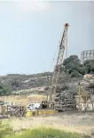  ?? TSAFRIR ABAYOV/AP FILES ?? Machinery works on a massive undergroun­d barrier on the Israeli side of the border with Gaza.