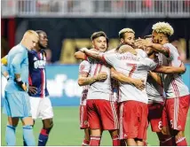  ?? MIGUEL MARTINEZ / MUNDO HISPANICO ?? Atlanta United had plenty to celebrate Wednesday in a 7-0 victory over the New England Revolution that matched the largest margin of victory in league history.