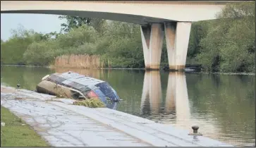  ??  ?? sinking feeling: The Environmen­t Agency would like to know who owns this boat on the River Nene in Peterborou­gh.