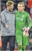  ?? FOTO: AFP ?? Loris Karius (re.) hat das Vertrauen von Trainer Jürgen Klopp.