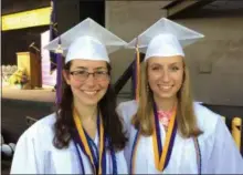  ?? GLENN GRIFFITH -MEDIANEWS GROUP ?? Ballston Spa High School Class of 2019 Valedictor­ian Sage Cowit, left, and Salutatori­an Angelene Roberts, right, get together before commenceme­nt at SPAC on Wednesday.