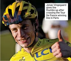  ?? ?? Jonas Vingegaard gives the thumbs-up after crossing the Tour De France winning line in Paris