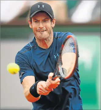  ?? Picture: GETTY IMAGES ?? FIRST-ROUND SURVIVOR: Great Britain’s Andy Murray returns to Russia’s Andrey Kuznetsov during their first-round French Open match yesterday