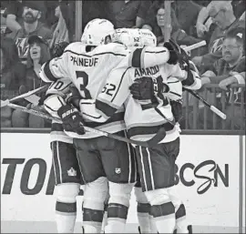  ?? Ethan Miller Getty Images ?? THE KINGS CELEBRATE after Paul LaDue’s second-period goal ended a scoreless streak of nearly 96 minutes against Vegas and evened the score at 1-1.